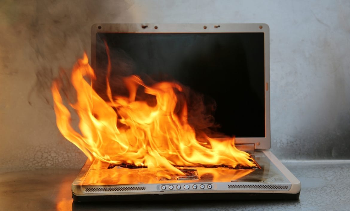Laptop on fire and flames. Computer Repair.