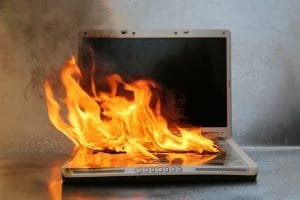Laptop on fire and flames. Computer Repair.