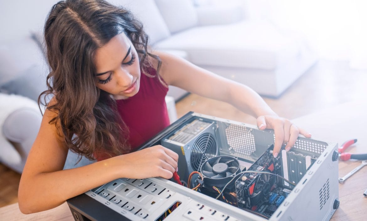 Woman repairing computer.