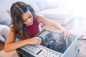 Woman repairing computer.