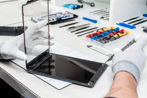 Close-up photos showing process of tablet device repair